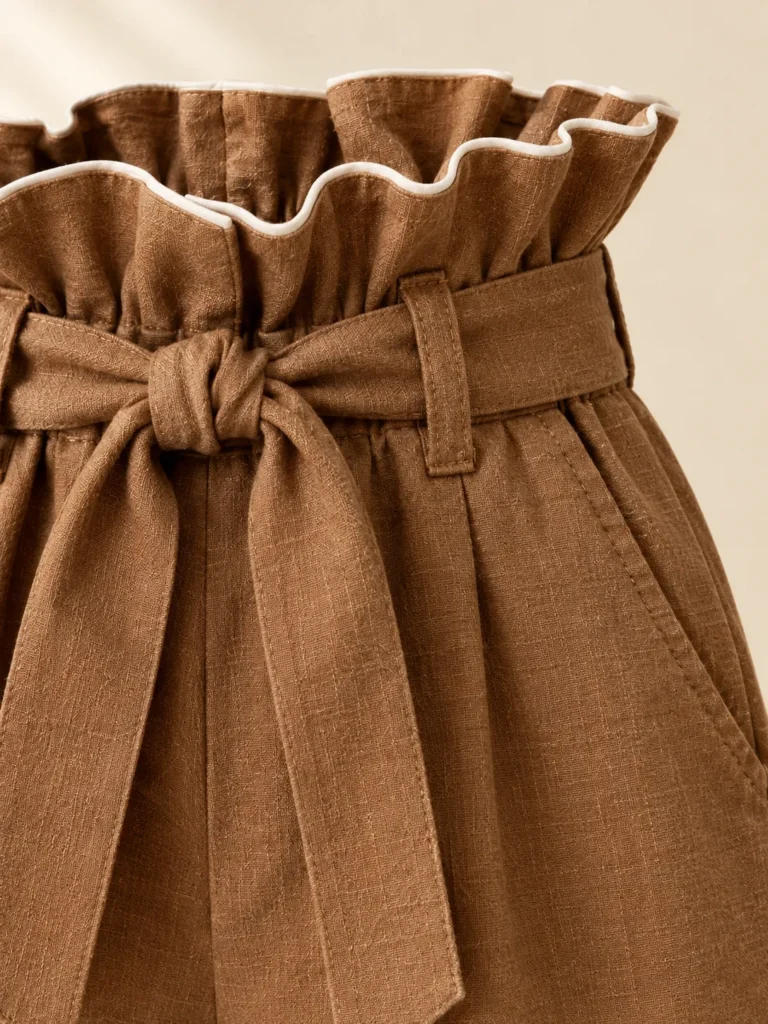 Close-up of the piping and construction on the Caramel Paperbag Short